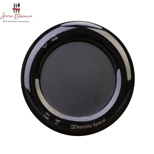 Barista Space mini drip digital coffee scale with integrated timer in round black design on coffee bar setup