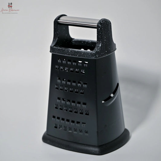 Black cheese grater on a gray background