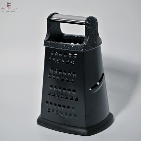 Black cheese grater on a gray background