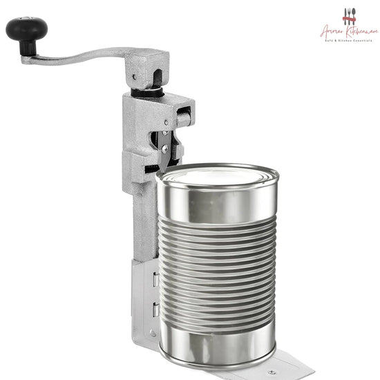 Commercial cast steel manual can opener featuring a table-mounted base plate and ergonomic turning handle.