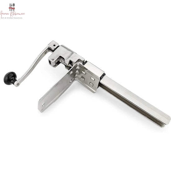 Commercial cast steel manual can opener featuring a table-mounted base plate and ergonomic turning handle.