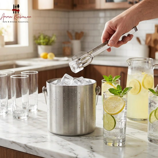 Stainless steel serving tongs with flat spatula and pronged fork heads for buffet dining and ice serving