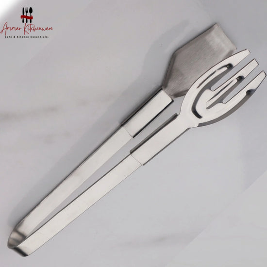 Stainless steel serving tongs with flat spatula and pronged fork heads for buffet dining and ice serving