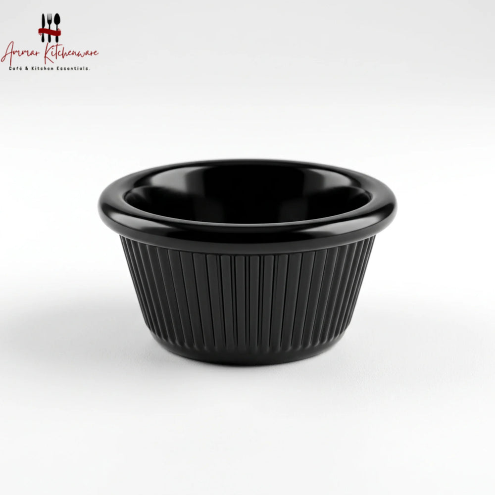 Black melamine ramekin dip cup with ribbed exterior texture and glossy rounded rim