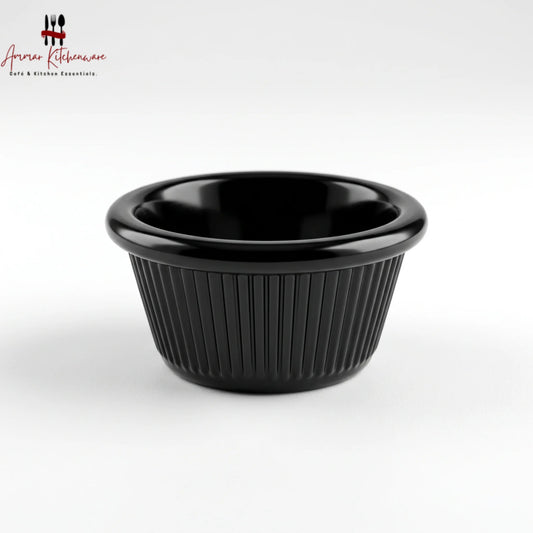 Black melamine ramekin dip cup with ribbed exterior texture and glossy rounded rim