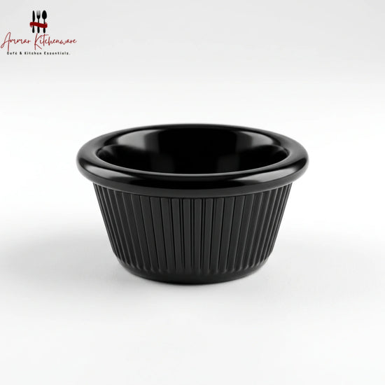 Black melamine ramekin dip cup with ribbed exterior texture and glossy rounded rim