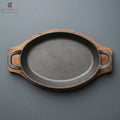 Cast Iron Oval Sizzler Pan with Dual Side Handles & Wooden Base