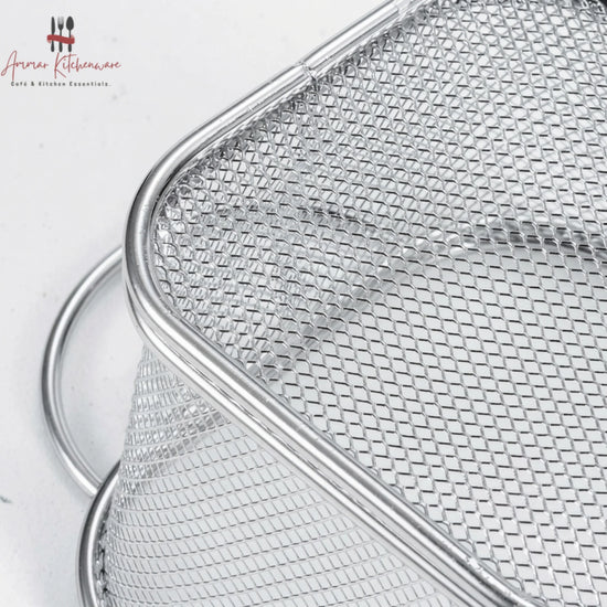 Round corner fry serving basket with wire mesh body, curved edges, and dual side loop handles on dining table