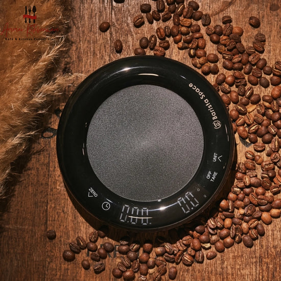 Barista Space mini drip digital coffee scale with integrated timer in round black design on coffee bar setup