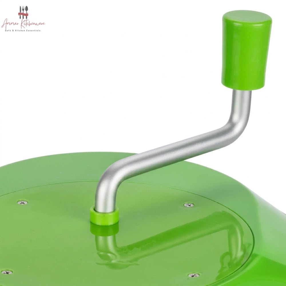 Commercial green salad spinner with metal hand crank arm and white inner colander basket